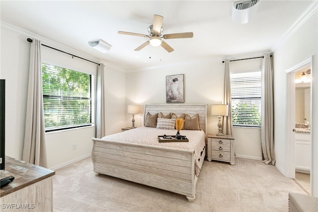 bedroom featuring ornamental molding, light carpet, and multiple windows