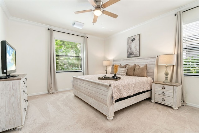 bedroom featuring light carpet, baseboards, a ceiling fan, and crown molding