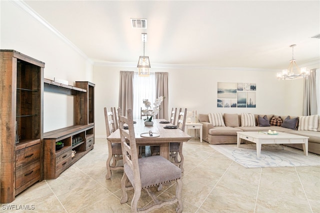 dining room with visible vents, a notable chandelier, and ornamental molding