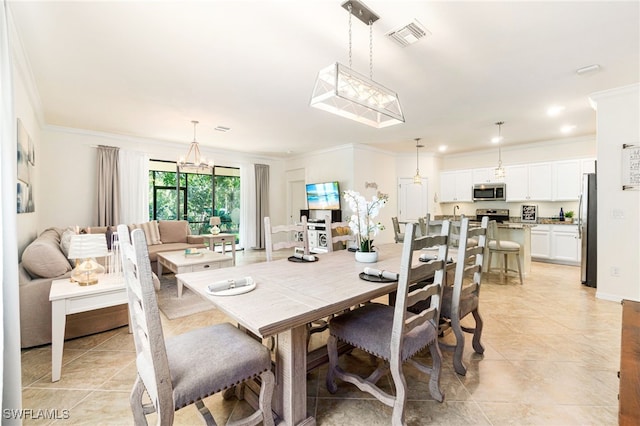 dining space featuring a chandelier, ornamental molding, light tile patterned floors, and visible vents