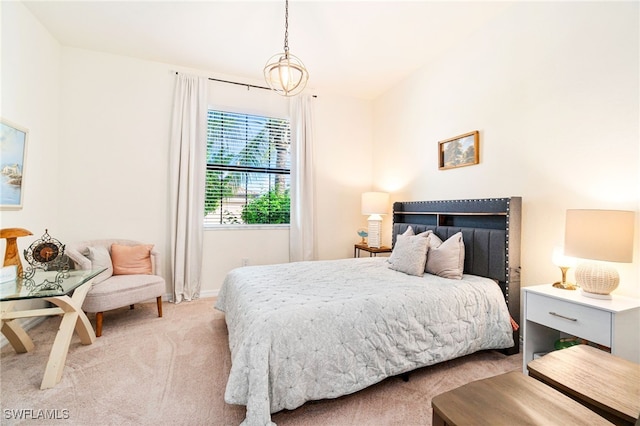 bedroom featuring light carpet