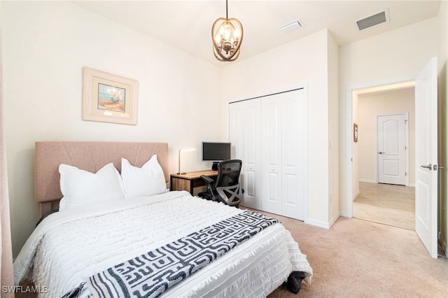 bedroom featuring a closet, visible vents, light carpet, and baseboards