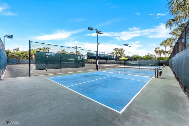 view of sport court with fence