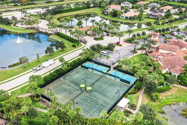 bird's eye view featuring a water view and a residential view