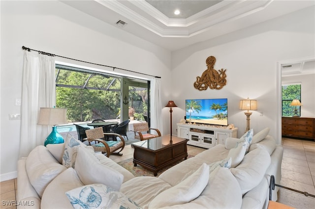 living room featuring ornamental molding and light tile patterned floors