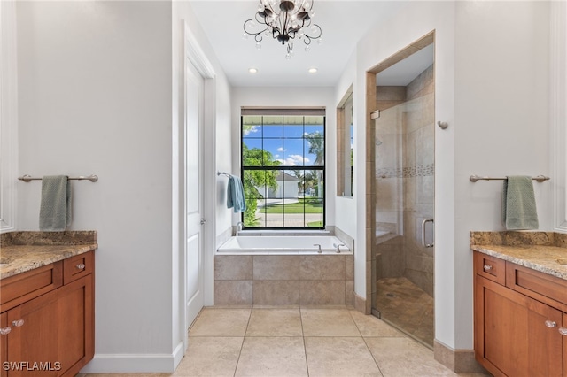 bathroom featuring vanity, a notable chandelier, independent shower and bath, and tile patterned floors