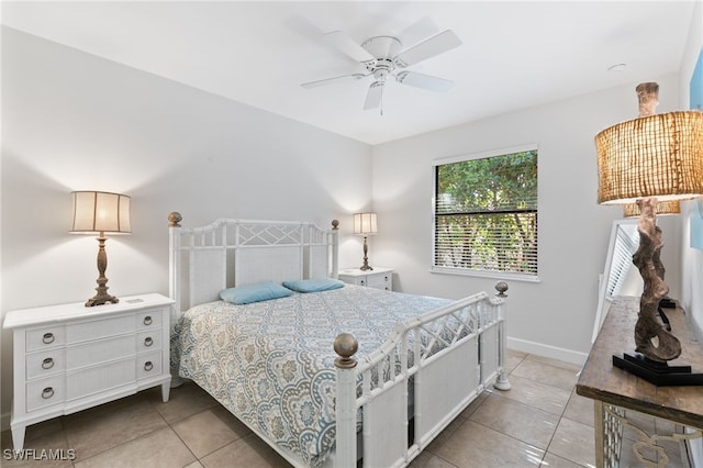 tiled bedroom with ceiling fan