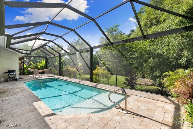 view of pool featuring a patio area and a lanai