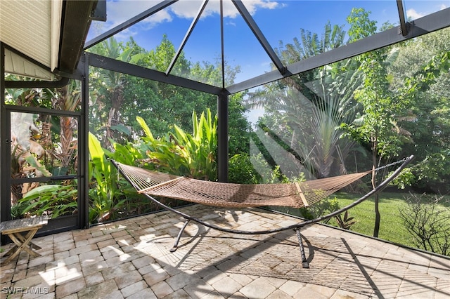 unfurnished sunroom featuring a wealth of natural light