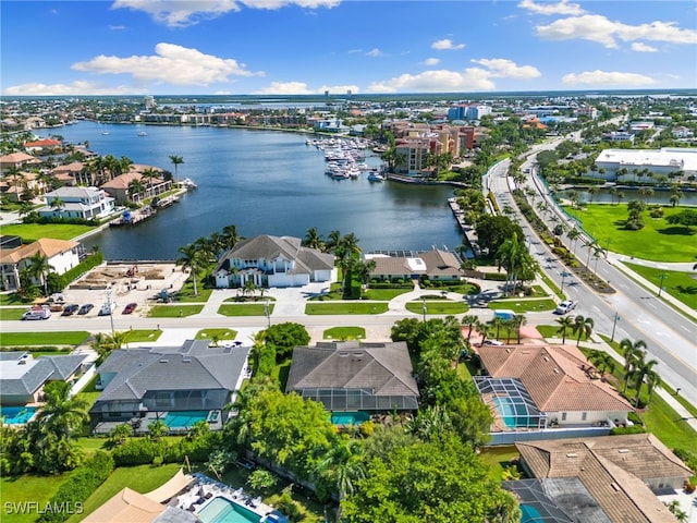 birds eye view of property with a water view