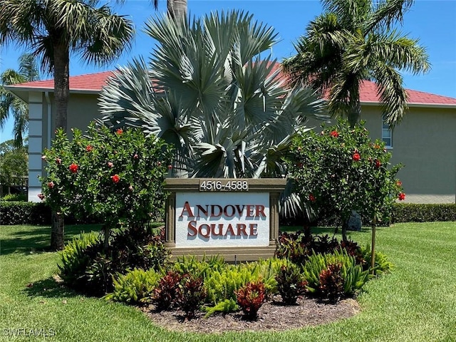 community / neighborhood sign with a lawn