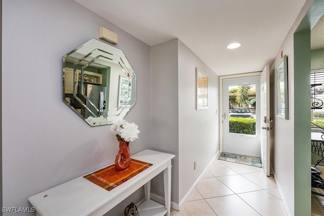 doorway to outside featuring light tile patterned floors