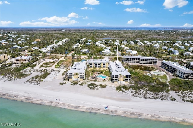 aerial view with a water view and a view of the beach