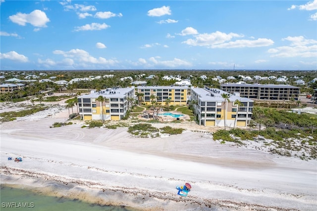 bird's eye view with a water view and a view of the beach