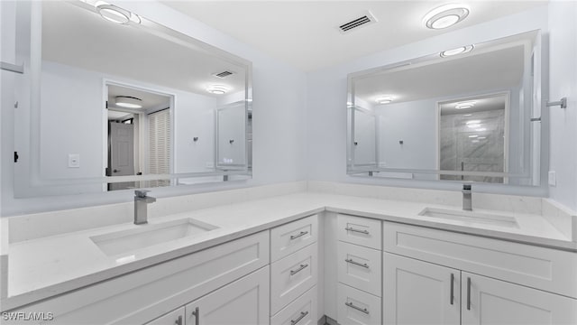 bathroom featuring vanity and a shower