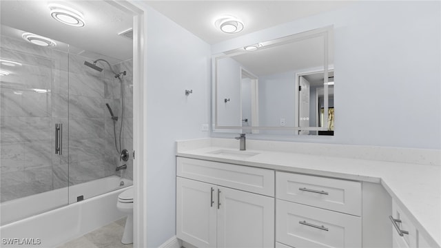 full bathroom featuring toilet, vanity, and combined bath / shower with glass door