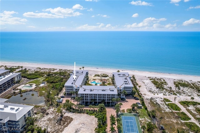 aerial view featuring a water view and a beach view