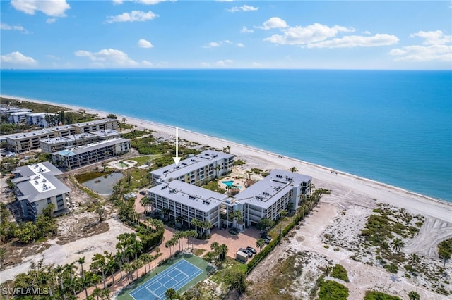 bird's eye view featuring a beach view and a water view