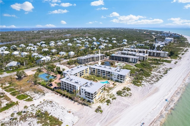 aerial view with a water view and a view of the beach