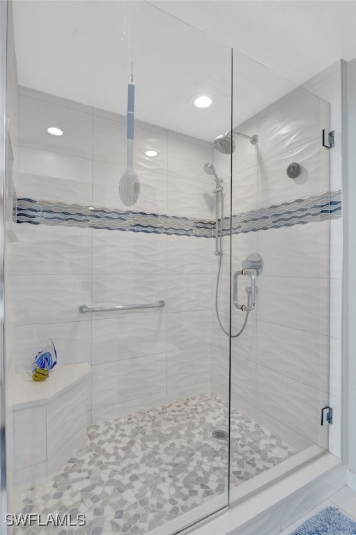 bathroom with a shower with shower door