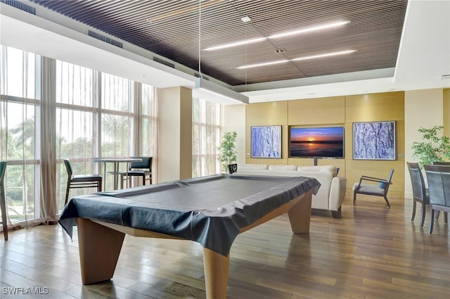 recreation room featuring hardwood / wood-style flooring, expansive windows, and billiards