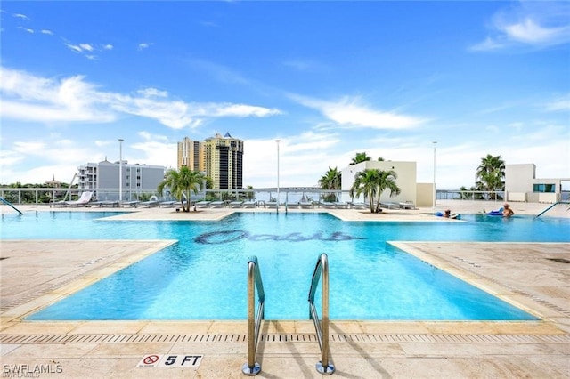 view of swimming pool featuring a patio