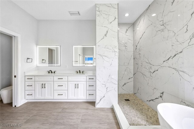 full bathroom featuring vanity, separate shower and tub, tile walls, and toilet