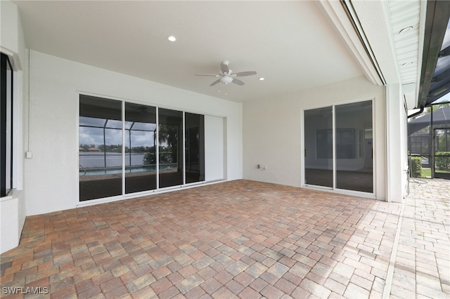 view of patio / terrace with a lanai and ceiling fan