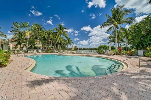 view of swimming pool with a patio area