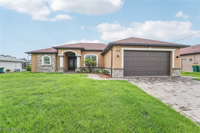 view of front facade featuring a garage and a front lawn