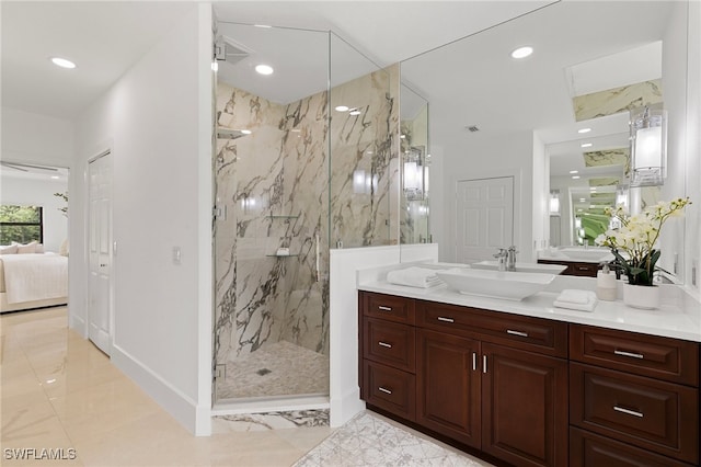 bathroom featuring vanity and an enclosed shower