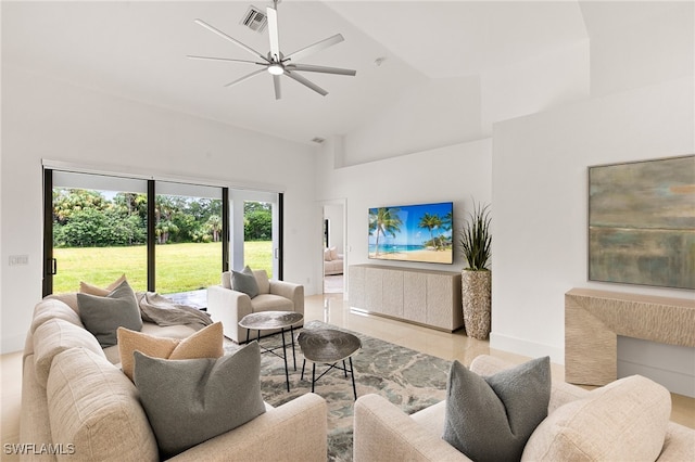 living room with ceiling fan and high vaulted ceiling