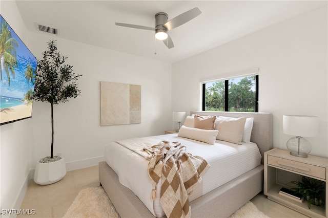 bedroom featuring ceiling fan and light colored carpet