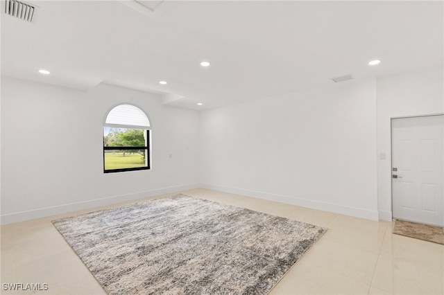 unfurnished room with light tile patterned floors