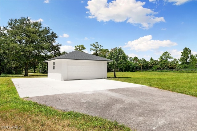 garage with a lawn