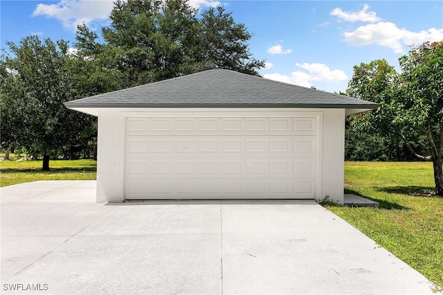 garage with a lawn