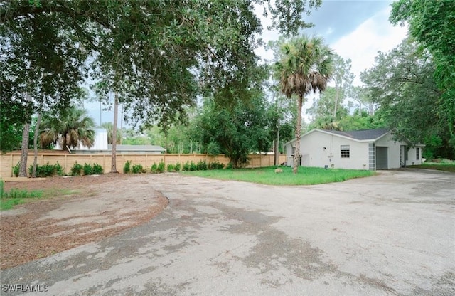 view of yard featuring a garage