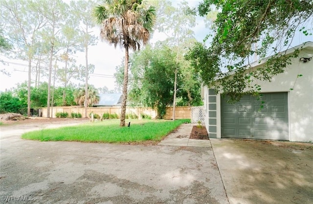 view of yard with a garage