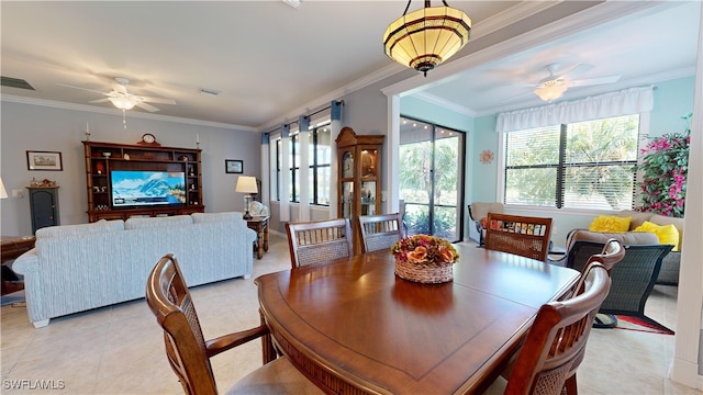 dining room with light tile patterned flooring, visible vents, a ceiling fan, and ornamental molding