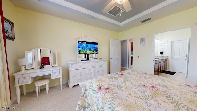 bedroom featuring visible vents, baseboards, a tray ceiling, and ornamental molding