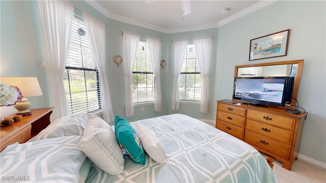 bedroom with crown molding and light colored carpet