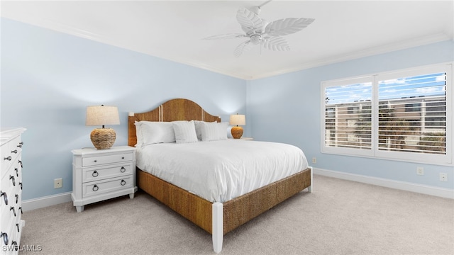 bedroom featuring crown molding, light carpet, and ceiling fan