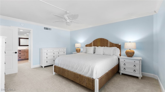 bedroom with crown molding, connected bathroom, and ceiling fan