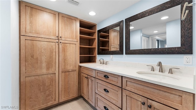 bathroom featuring vanity and tile patterned flooring