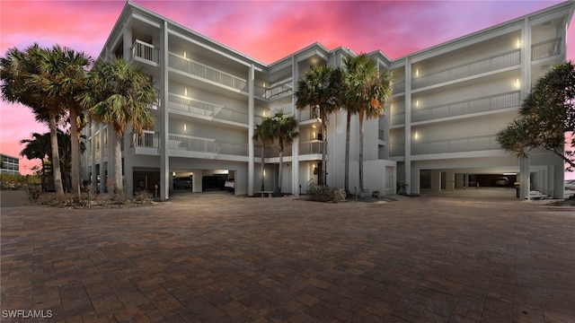 view of outdoor building at dusk