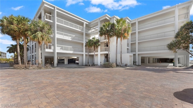 view of building exterior featuring a carport