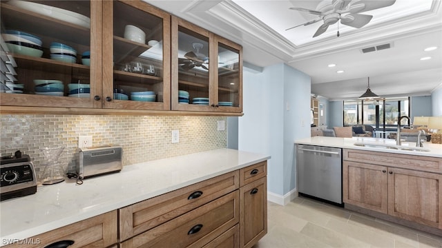 kitchen featuring decorative backsplash, hanging light fixtures, sink, crown molding, and stainless steel dishwasher