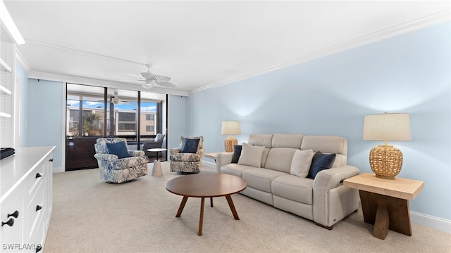 carpeted living room with crown molding and ceiling fan