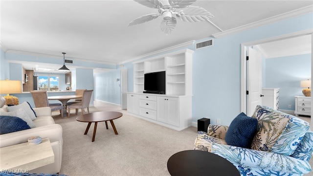 living room with ceiling fan, light carpet, and ornamental molding