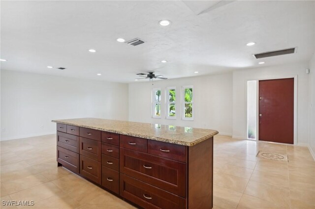 kitchen with recessed lighting, visible vents, and baseboards